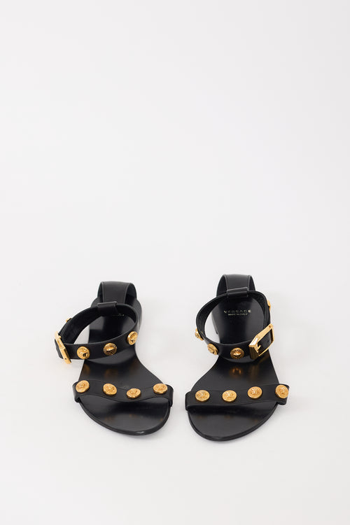 Versace Black 
Gold Leather Medusa Embellished Sandal