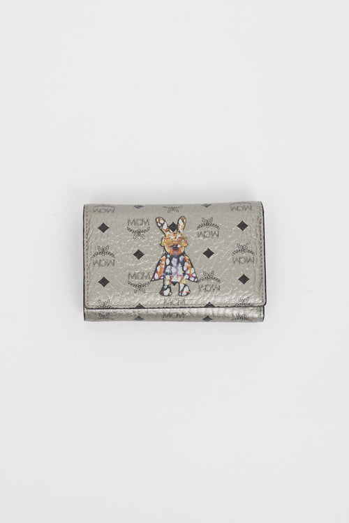 MCM Silver 
Multi Logo Graphic Trifold Wallet