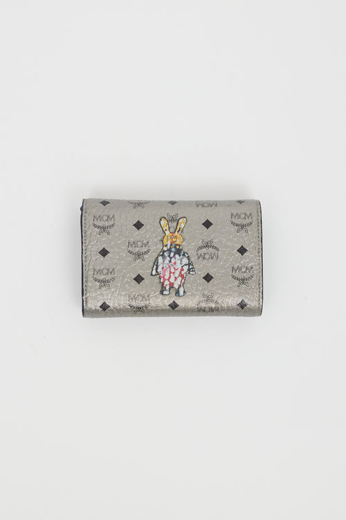 MCM Silver 
Multi Logo Graphic Trifold Wallet