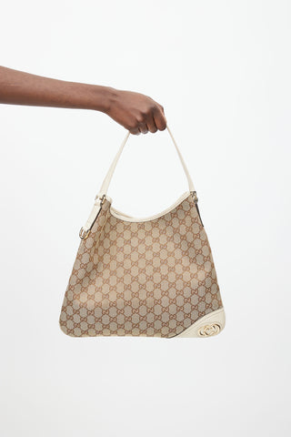 Gucci Brown 
Cream Canvas Monogram Britt Shoulder Bag