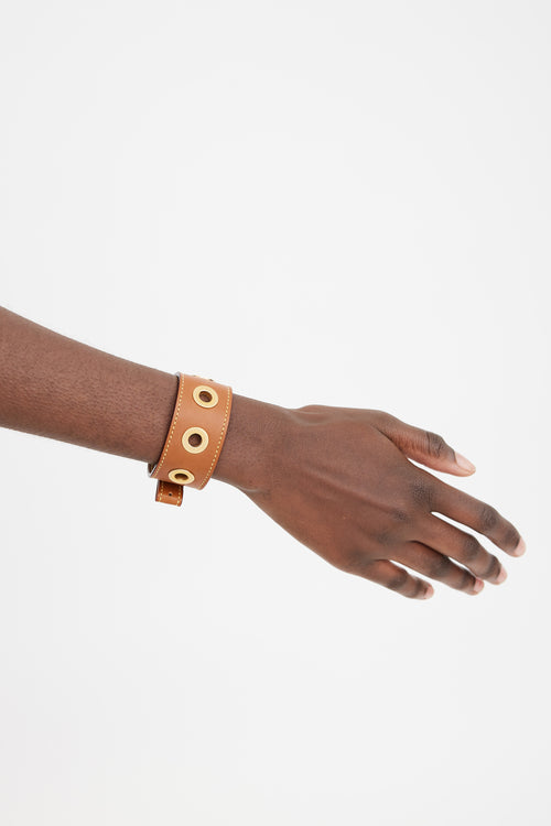 Louis Vuitton Brown 
Gold Leather Grommet Bracelet