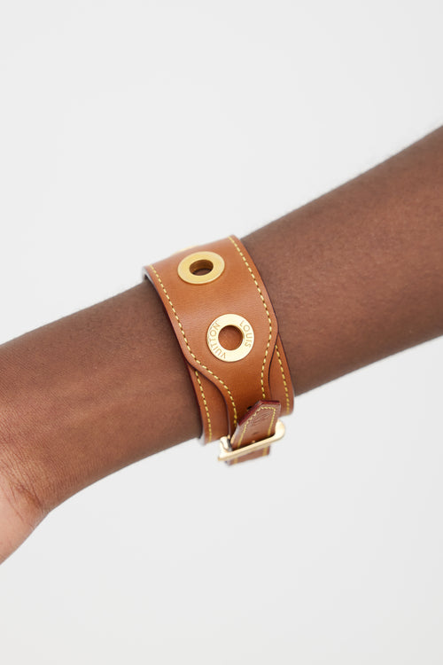 Louis Vuitton Brown 
Gold Leather Grommet Bracelet