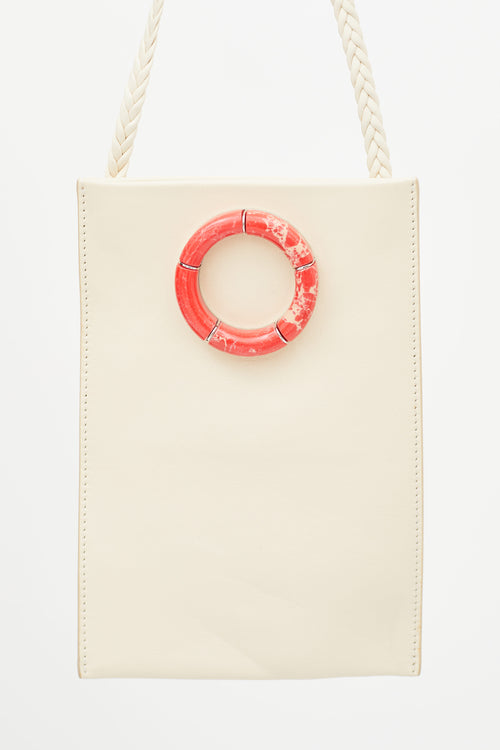 The Row Cream Leather 
Red Round Marble Medicine Pouch